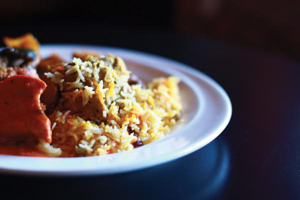 Photo by Kathy Tran  | The chicken biryani sits marinating in the chicken masala.