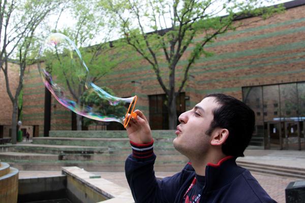 Photos by Ardy Badakhshanian |  Student Baruk Bakirdoven blows up a bubble in celebration of Earth Day.