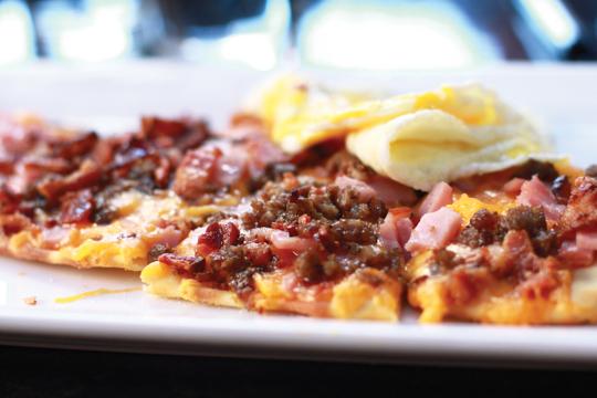 Photos by Kathy Tran and Scott Mitchell | The sausage, bacon, egg and cheese flatbread provides a hearty breakfast.