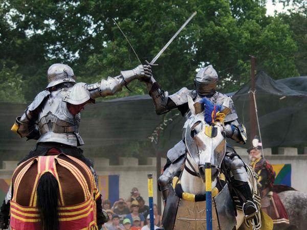 Knights reenact a joust. 