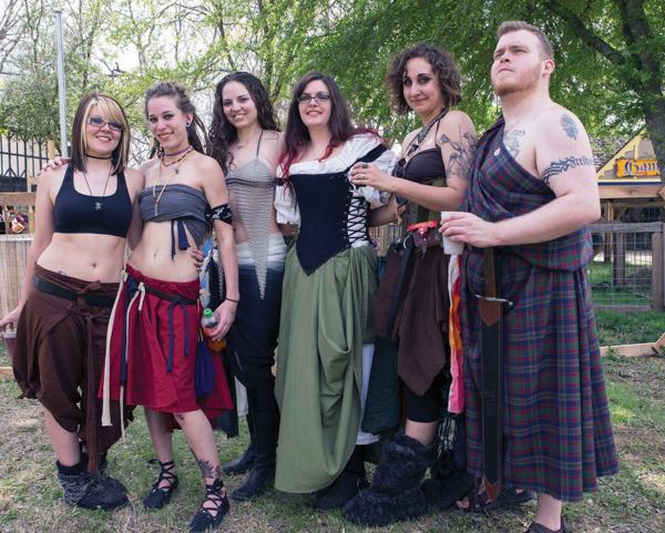 Photos by Earl Ward |  Sparrow Dynamic, Brookhaven student Kelley Franklund (derby name WreckLiz N Dangerous), Ares Fury, Diablo Codeine, and Slayer Delilah of Assassination City Roller Derby pose in their festival dress with Tim. 