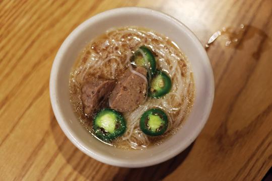 Photos by Scott Mitchell |  Sliced jalepenos add a little extra kick to a warm bowl of pho. 