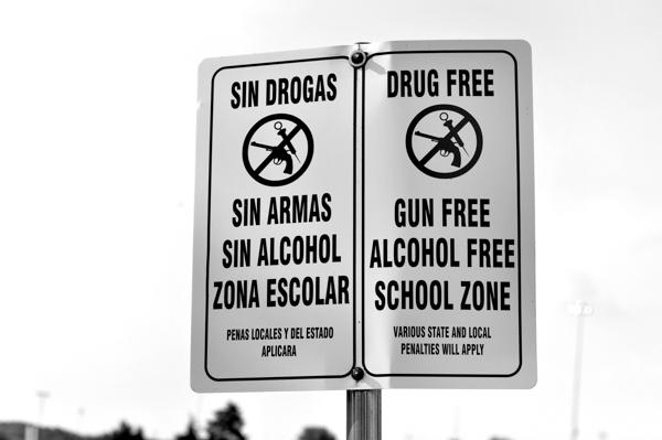 Photo by Adriana Salazar | The signage at the main entrance to campus, taken Sept 9, reflects DCCCD policy prior to the passage of the "Guns in Cars" bill. 