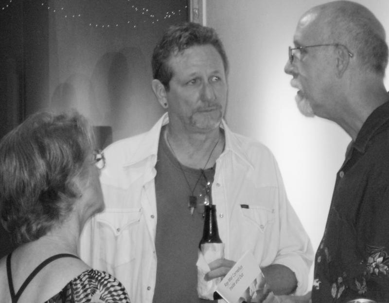 Photos by Chris R. Allison | Cornelius mingles with guests at the gallery