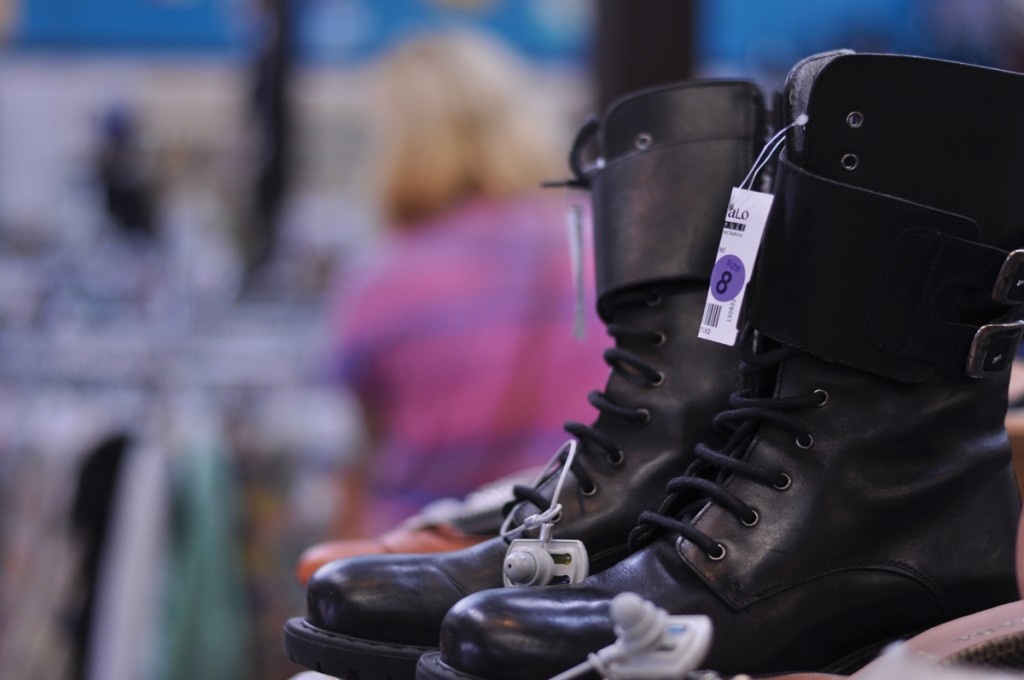  A pair of women’s leather boots, a fashion trend for fall, are on a shelf ready to be sold