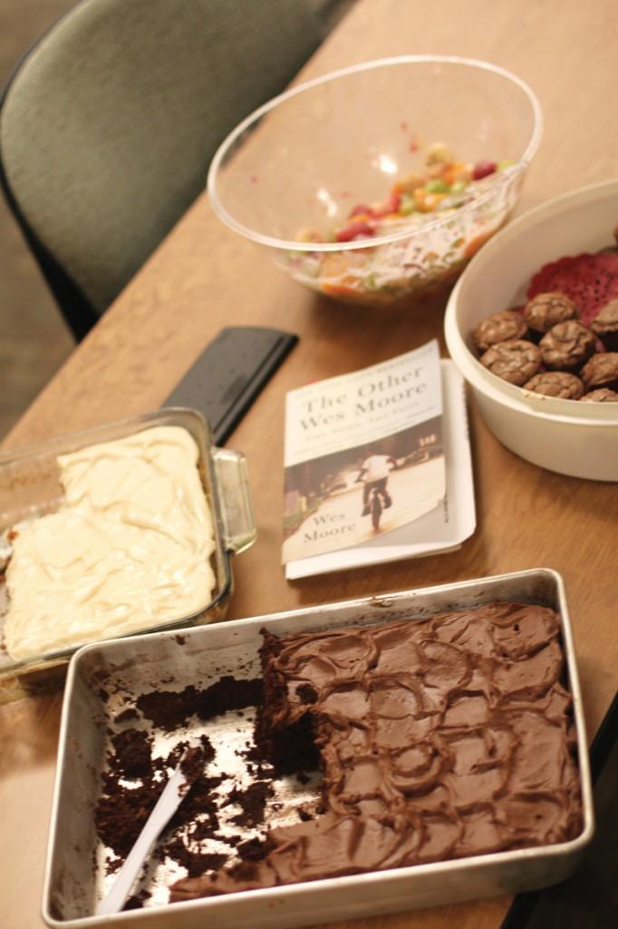 Photo illustration by Brigitte Zumaya | Fudge-iced brownies and bowls of sweets  await guests on the table at the Sweet Talk Sept. 24.