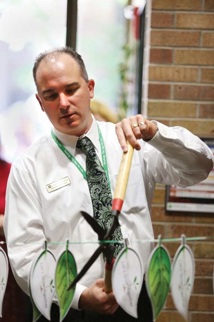 Dr. Thom Chesney, president of Brookhaven College, cuts the ribbon to the Employee Success Center Sept. 30.