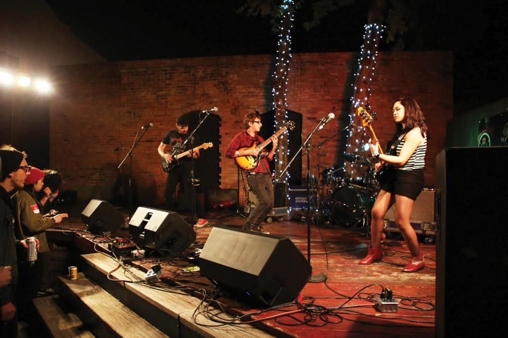 Photos by Scott Mitchell | Hunter Moehring, Samantha Villavert and Alex Poulos break away from their mics to play furiously on their respective instruments.