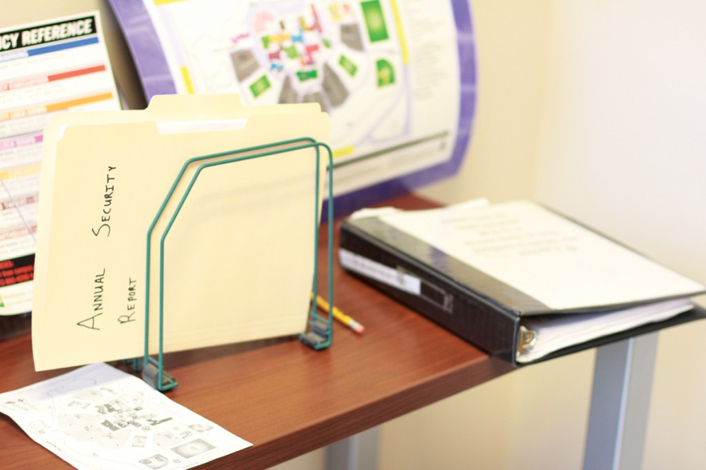 Photo by Maddox Price | Alongside the criminal log book, the annual security report also stays on top of a table in the office of the campus police. 