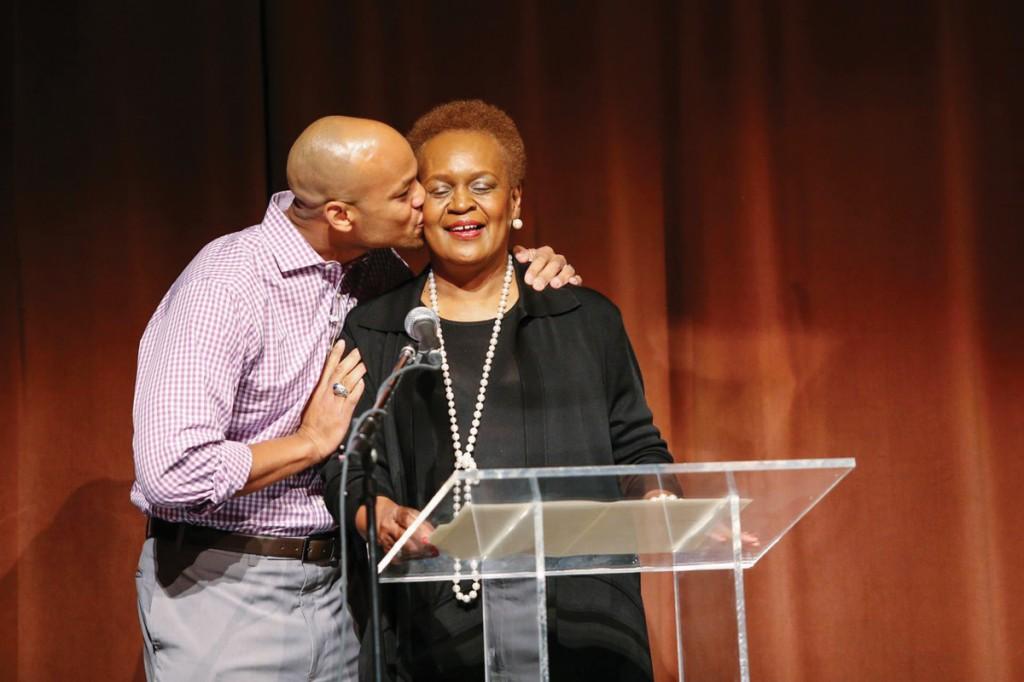 Moore gives a warm embrace to Hazel Carlos soon after she introduces him to the audience.