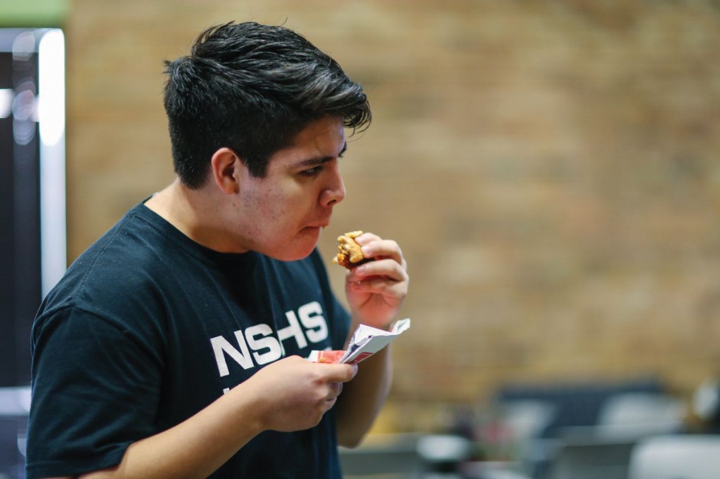 Brookhaven student Edgar Rodriguez feasts on his chicken sandwich outside the T Building Jan. 13.