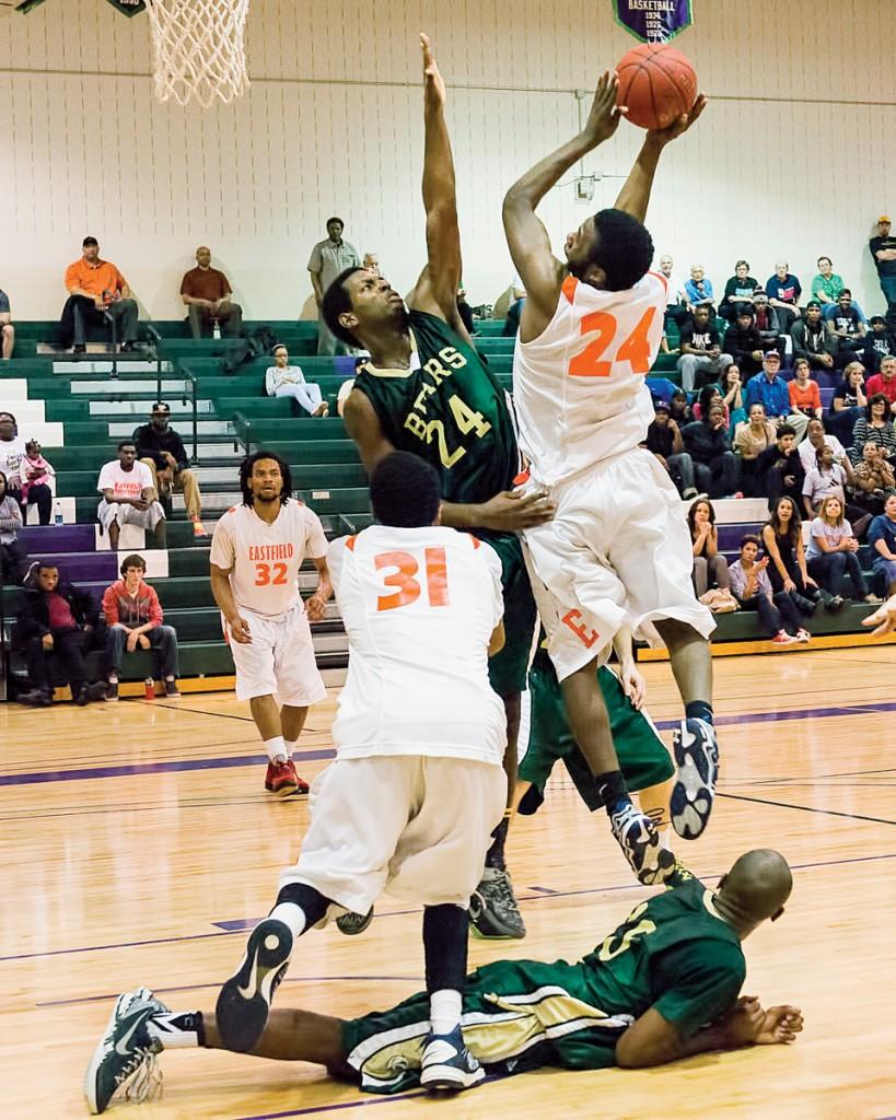 Photo by Scott Godbey | Brookhaven guard Tray Baldwin (#24) attempts to block the shot after guard Curtis Gile (#33) unsuccessfully attempted to steal the ball from an Eastfield offensive player.