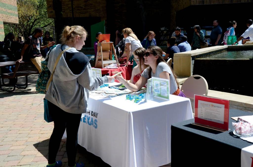 Photo by staff photographer | Brookhaven College student visits one of the booths at the annual Earth Day Fest.
