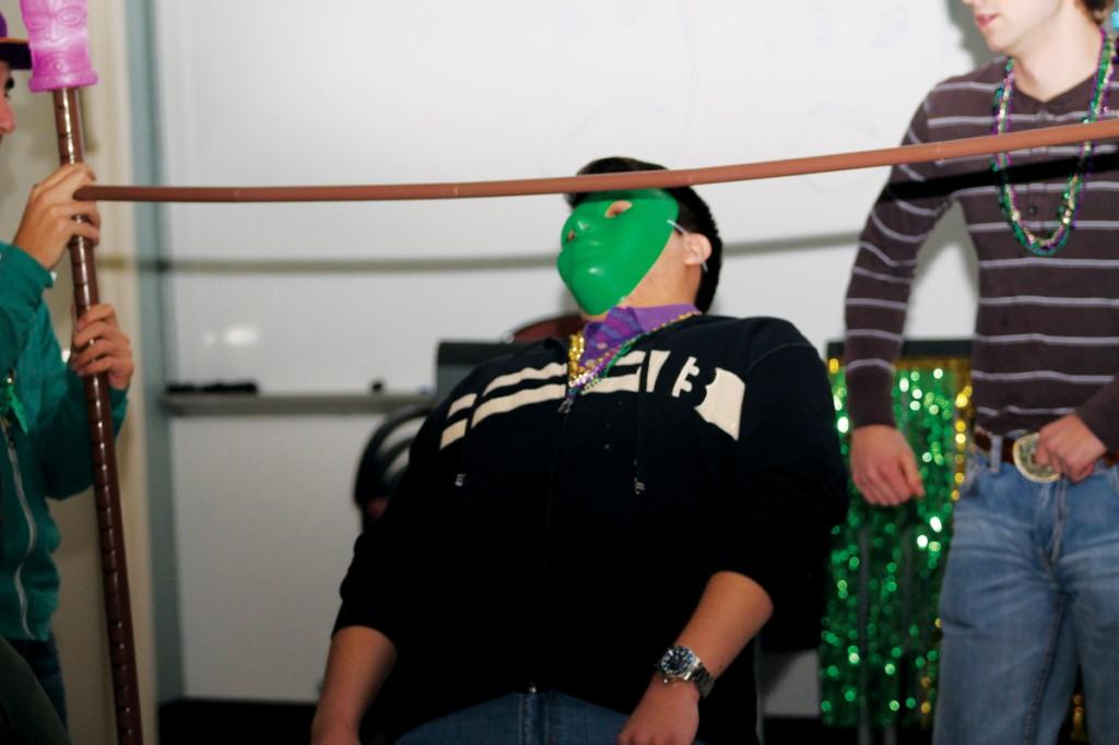 Photos by Ravin Lee | Students embraced the spirit of Mardi Gras by donning masks and celebrating with food and dance.