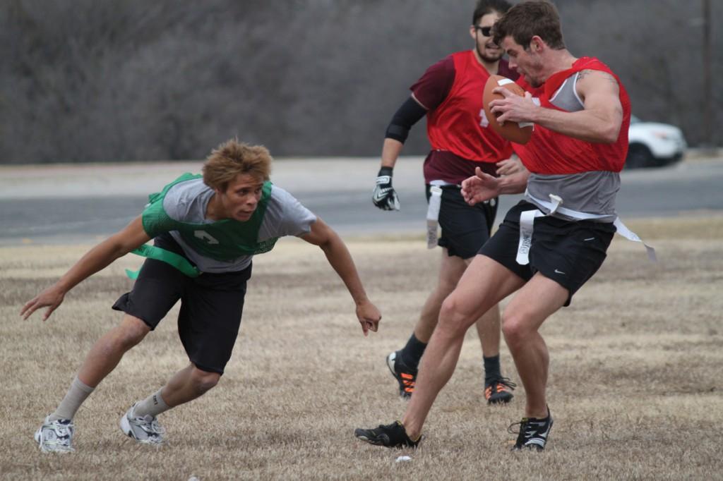 Photo by Brigitte Zumaya | Player Robert Short attempts to grab ballcarrier Nick Way’s flag during a heated scuffle. 