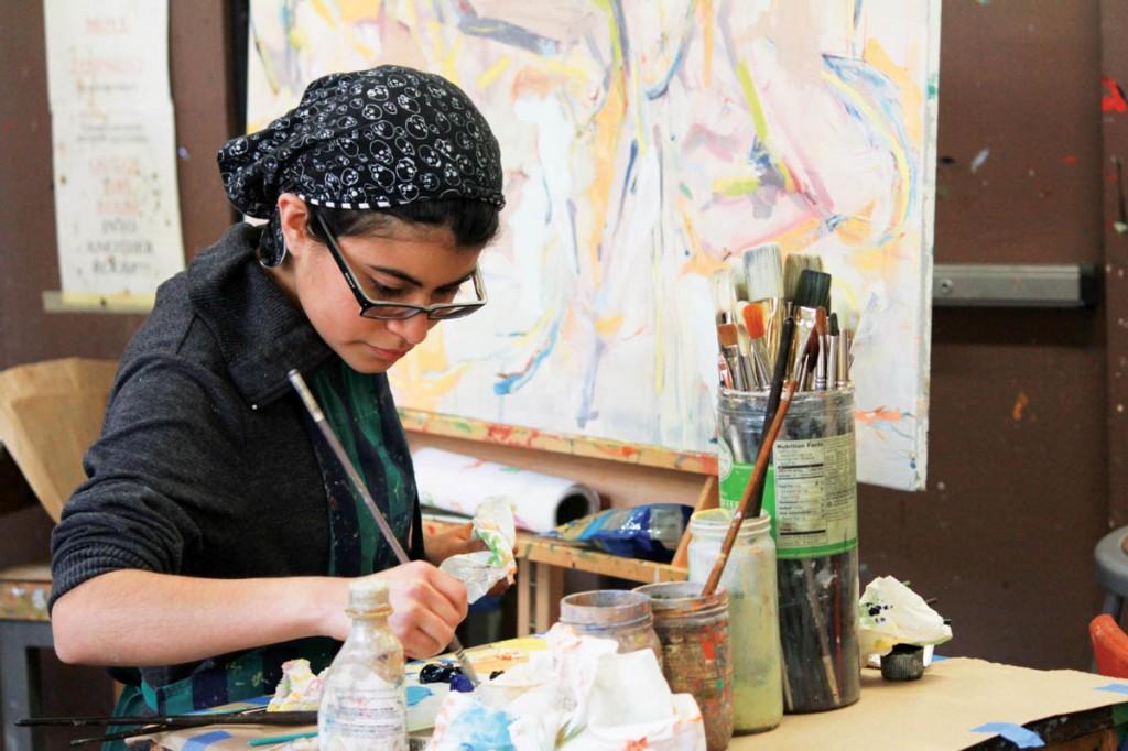 Photos by Nicholas Bostick | Brookhaven College art student Kenya Diaz finishes her painting. One of Diaz’s paintings was accepted to be featured at the Founder’s Foyer Rotating Art Exhibition. 
