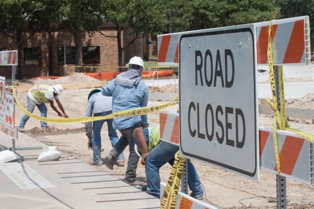 Photo by Brigitte Zumaya | Construction workers have been hard at work replacing the asphalt parking lot with more durable and costeffective concrete since summer.