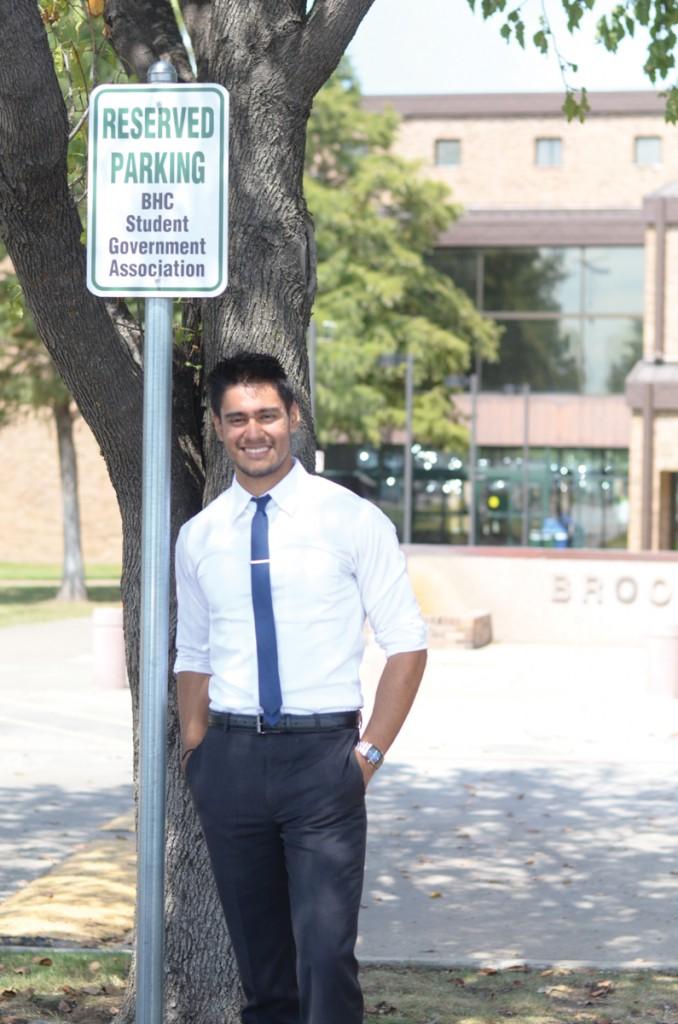 Photo by Travis Baugh | SGA president Jordan Cisneros stands in front of his former parking spot.