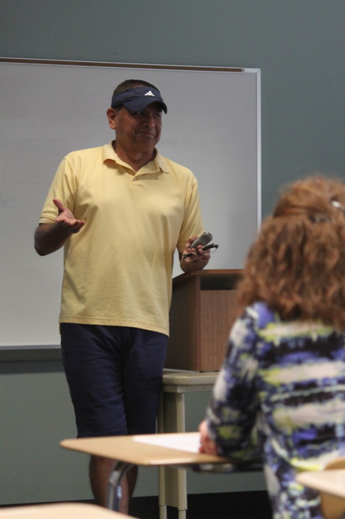 Photos by Brigitte Zumaya | Left: Gregorio Hernandez interacts with the audience by asking them questions about physical wellness and their past experiences.