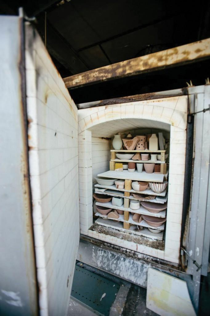 Photos by Kathy Tran | Student pottery is placed in the kiln and then baked for durability.