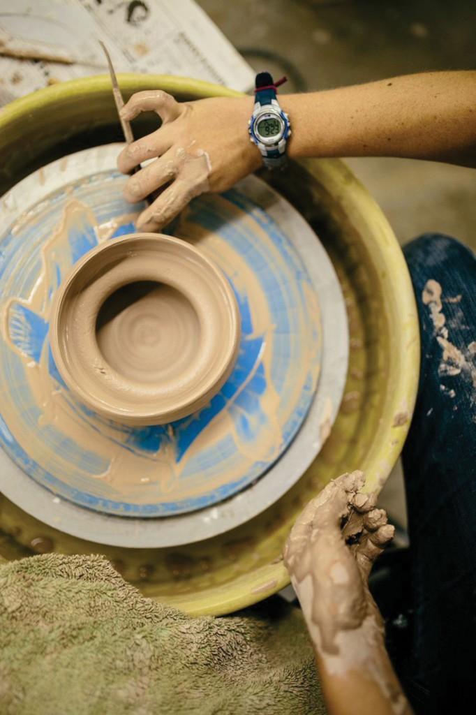 Photos by Kathy Tran |The bottom of this bowl is being rounded out by a student. 