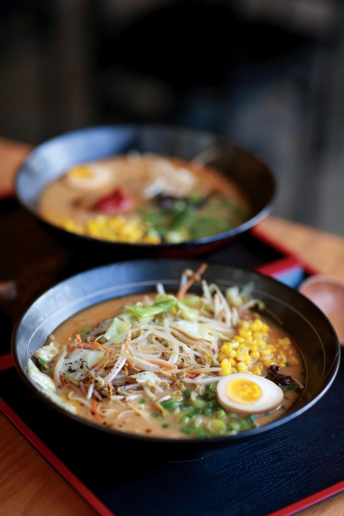 Photo by Adriana Salazar | A steaming bowl of vegetable miso ramen sits in front of a bowl of spicy miso ramen.