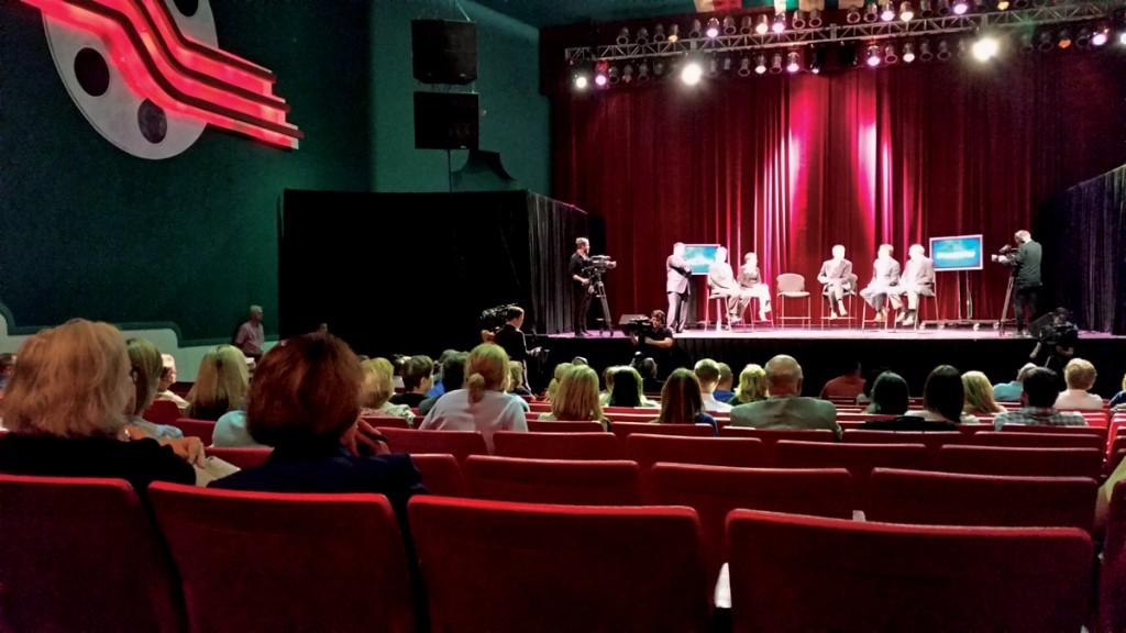 Photo by Tyler Satchwell | The audience asks questions and listens to panelists address Ebola concerns while WFAA-TV films the Facts Not Fear event at the Lakewood Theater.