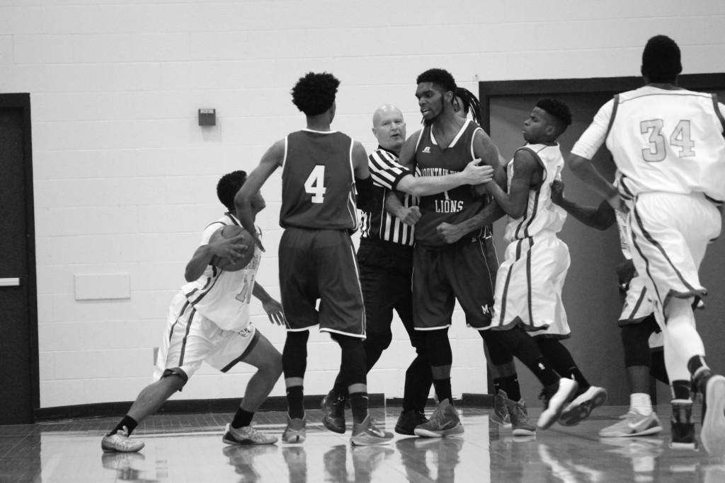 Photos by Brigitte Zumaya |Tension rises as Mountain View Lion Anthony Walker Jr. (#1) and Brookhaven Bear Blake Ervin (#10) are separated by the referee and teammates during a heated moment.