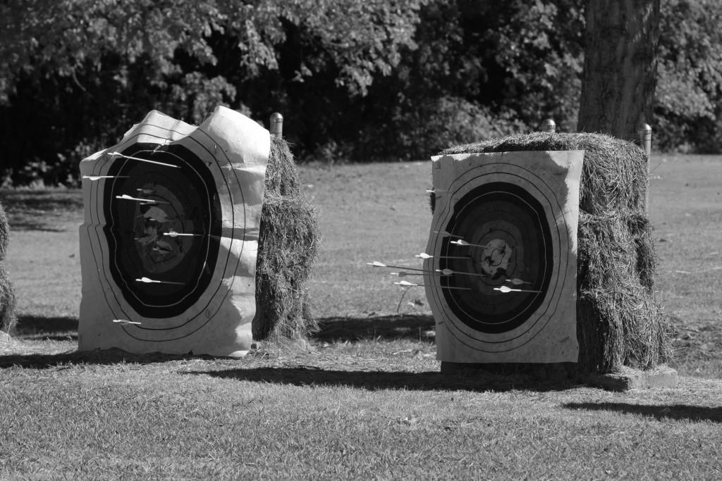 Students practice shooting at designated targets, and landing arrows on a bullseye earns them points. 