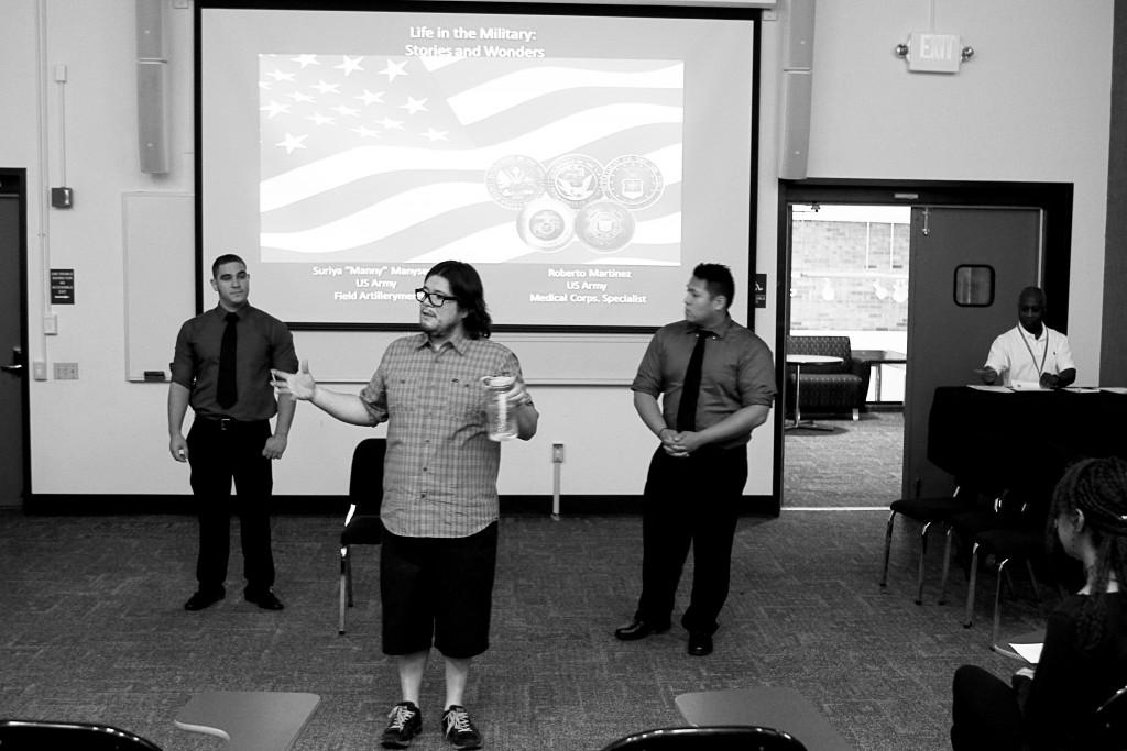 Willie R. Cole | Senior Staff Photographer Brookhaven humanities professor Victor Armenta (middle) introduces veterans Roberto Martinez (left) and Suriya Manyseng (right).