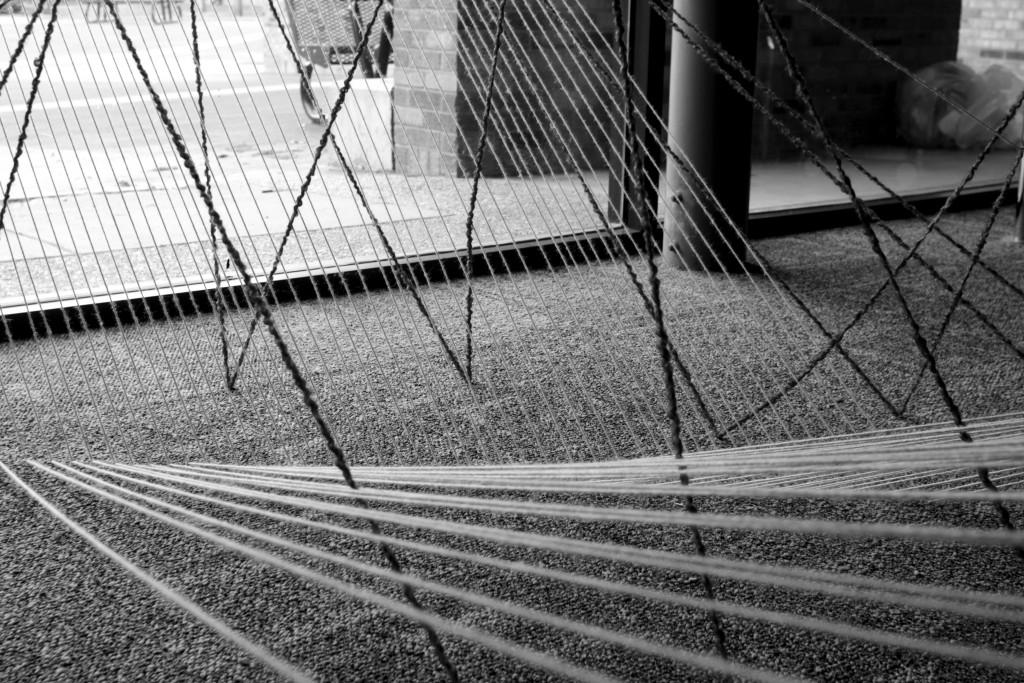 Photos by Evan Henry| Courier Colored yarn shapes itself around a stairwell to match the jazzy tempos of The Bad Plus.