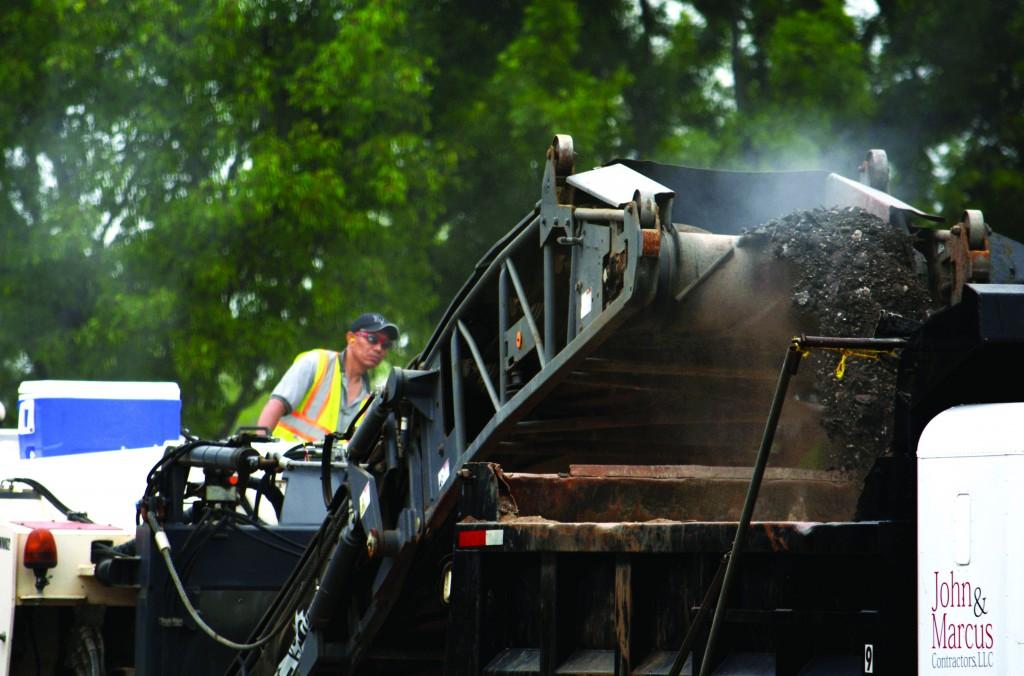 The cold milling machine crushes the asphalt, which will be recycled as an aggregate new pavement of the parking lot. Milling the old asphalt will reduce the impact that resurfacing has on the environment 