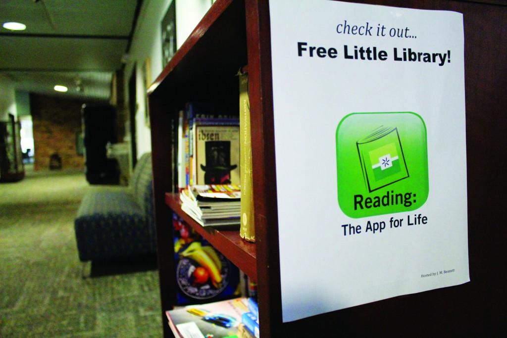 The free little library bookshelf is stacking with plenty visually appealing and educational books and magazines