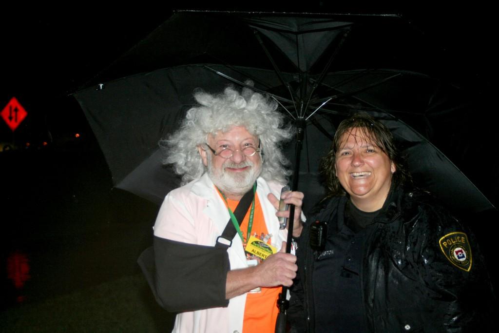 Photos by Andrew Zavala Chaz Hafey, Brookhaven College astronomy and physics lab coordinator, dressed as Einstein, and Vikki Ethington keep high spirits as they shelter from the rain.