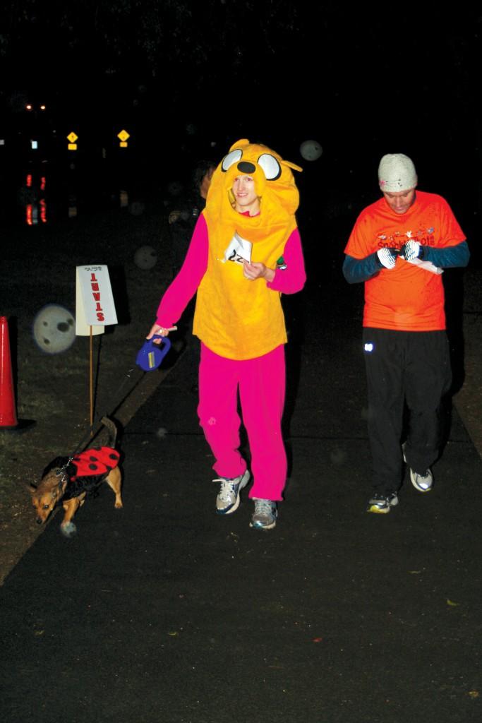 Sarah Epstein, dressed as Jake from “Adventure Time,” brought her dog, dressed as a lady bug, to run with her.