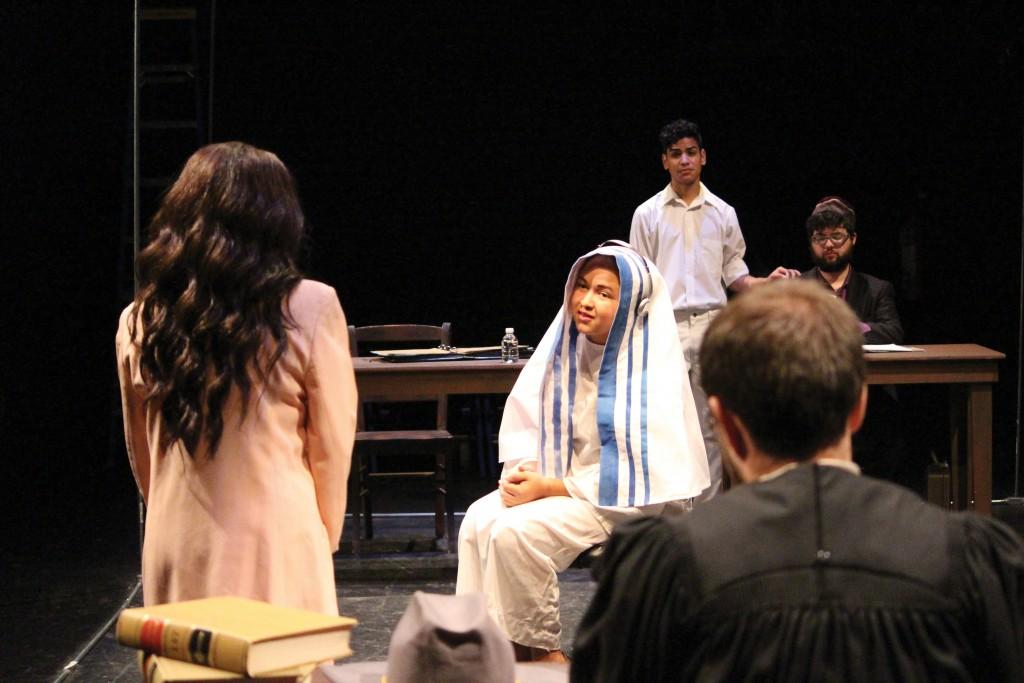 Photo by Brigitte Zumaya | Jayden Russell, a student playing Mother Theresa, is being questioned by Dayna Fries , a student playing a lawyer, in “The Last Days of Judas Iscariot” in a dress rehearsal Dec.1.