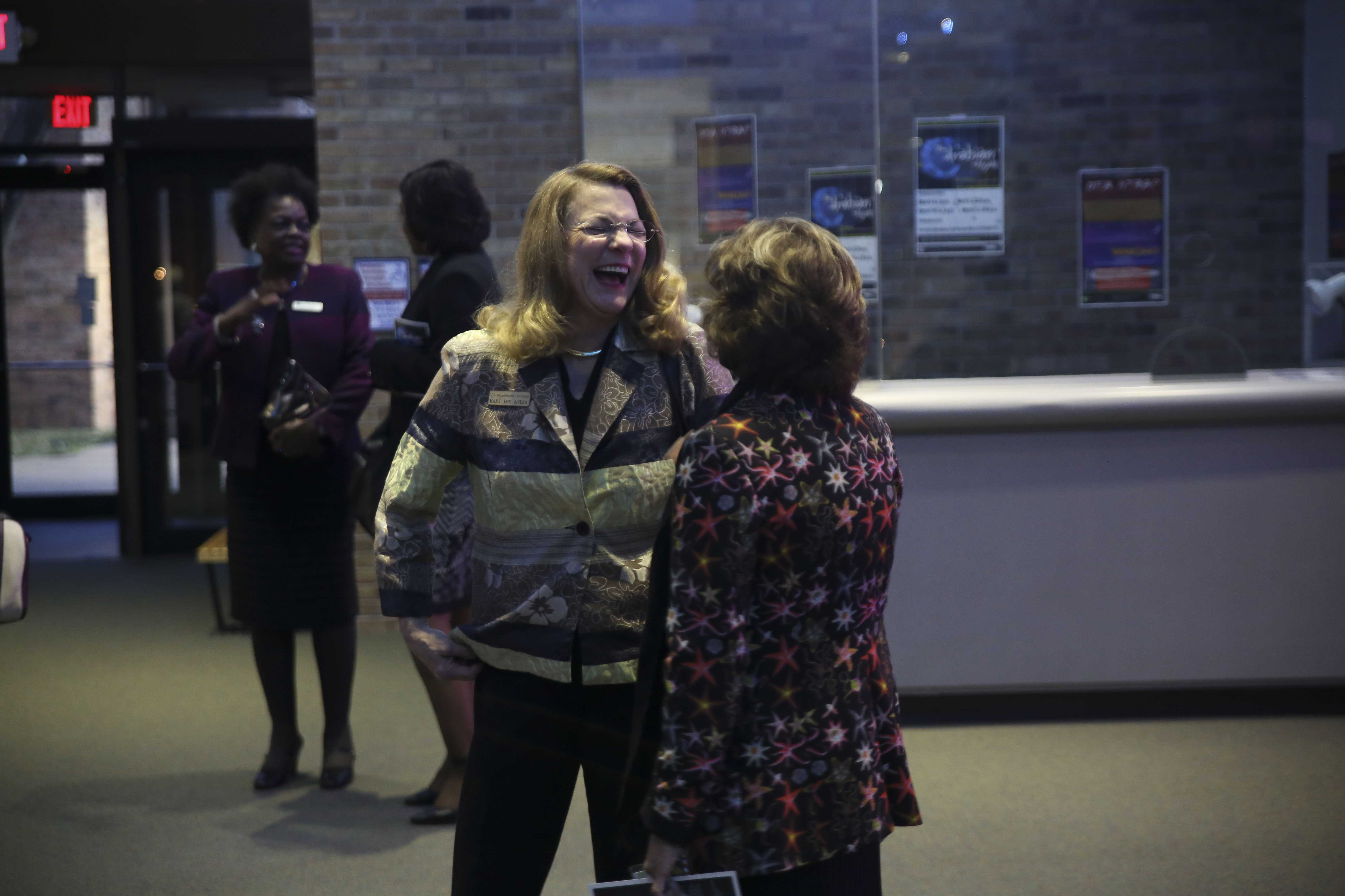 Photos by Aina Abdul-Qader | Mary Lou Avera, Brookhaven College faculty member, enjoys conversation at the alumni event. 