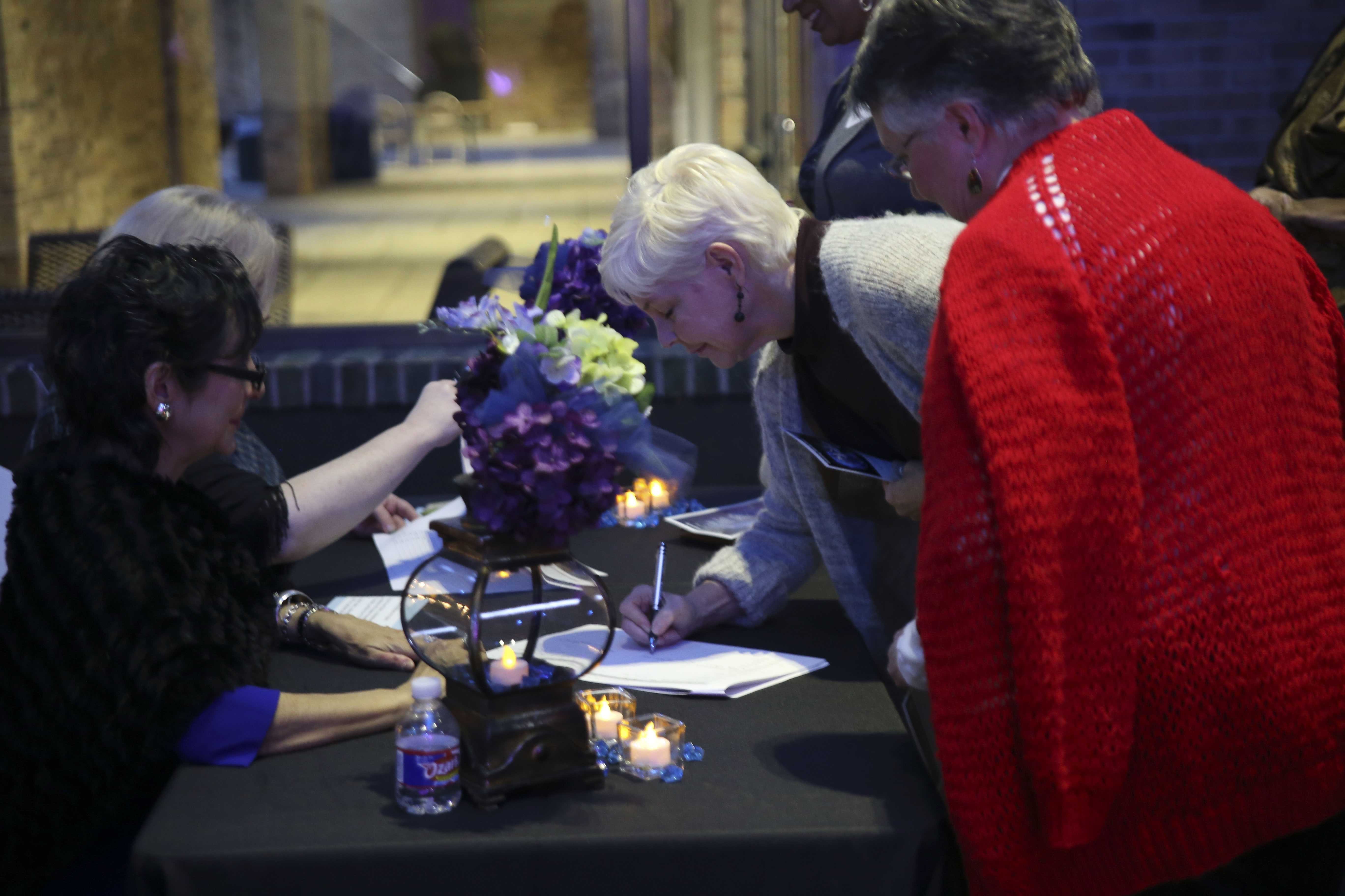 Guests sign in at the beginning of the event