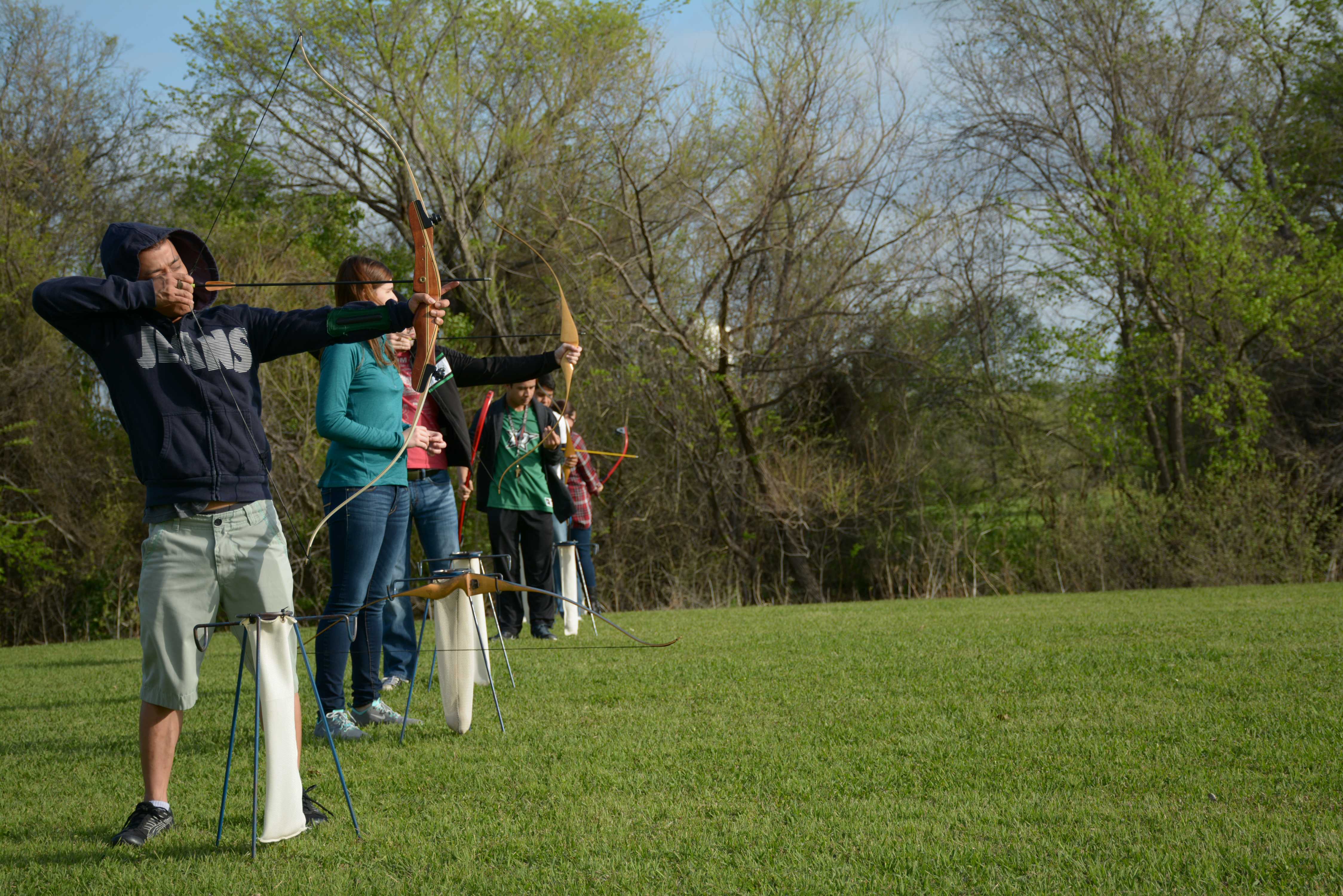 Photos by Jubenal Aguilar|  Hung Trang, a student, draws the arrow and prepares to take a shot with his recurve bow.