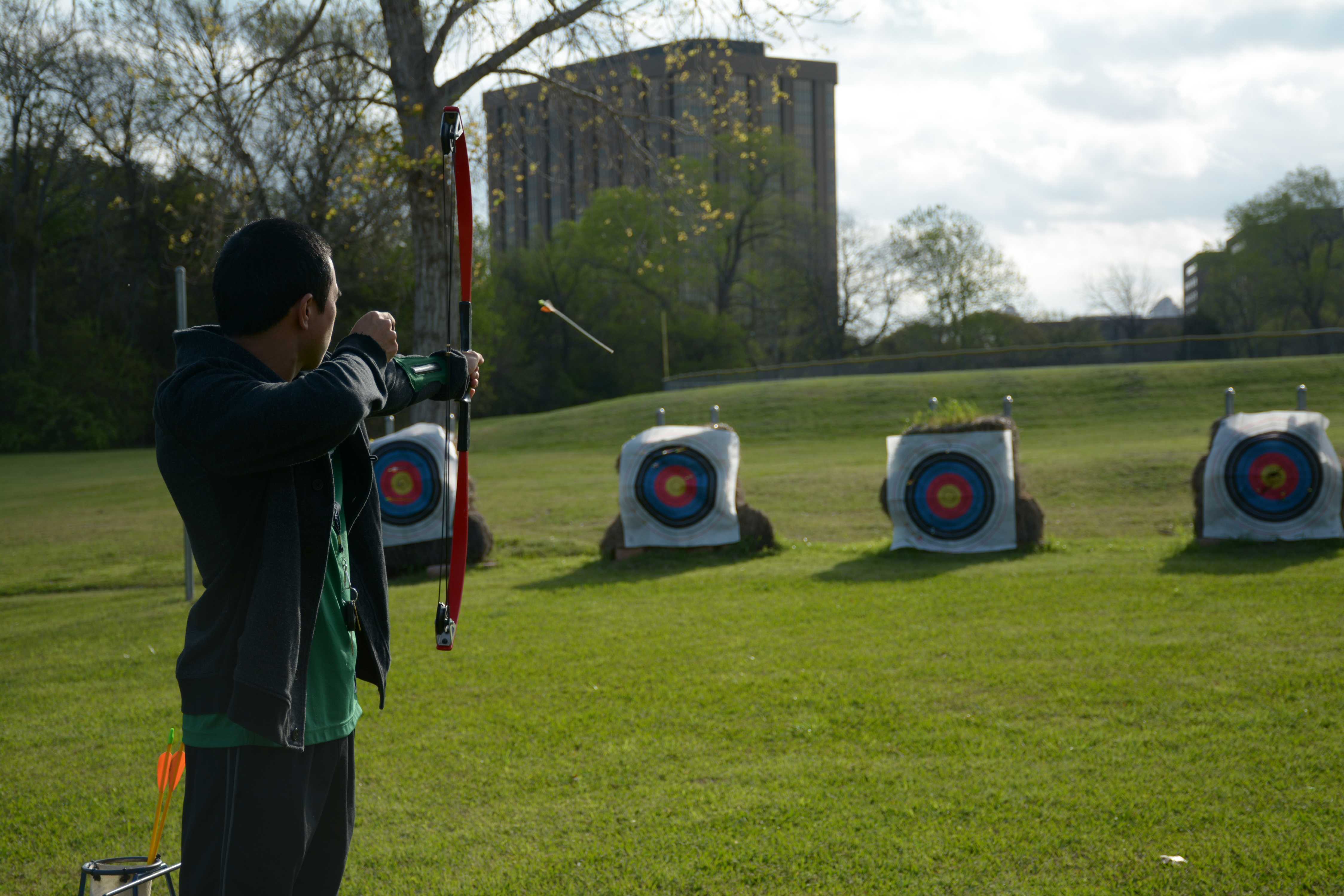 Ribery Kinsella, a student, shoots an arrow with a compound bow