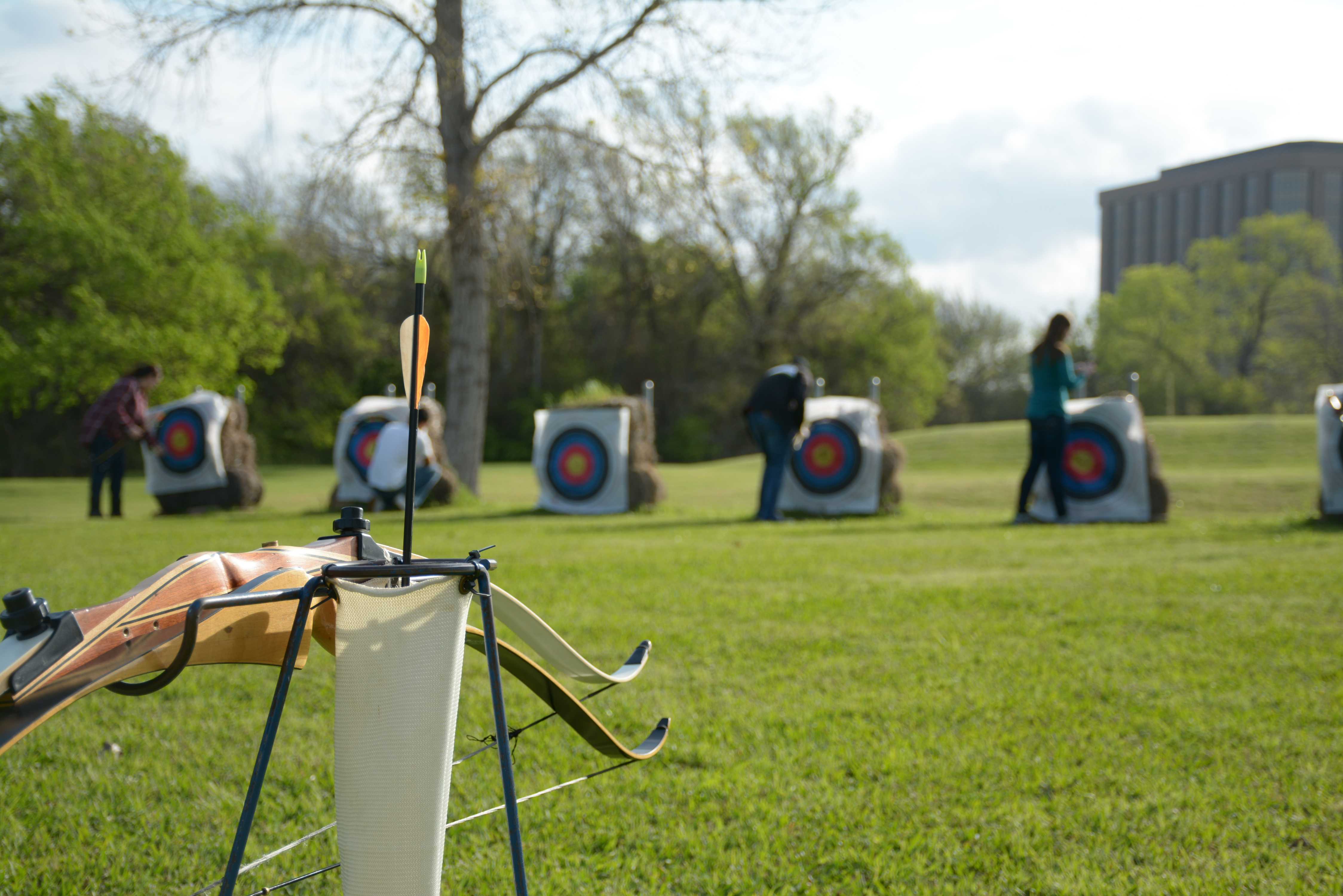 a single arrow is left in the quiver as archery students retrieve their shots and total their scores