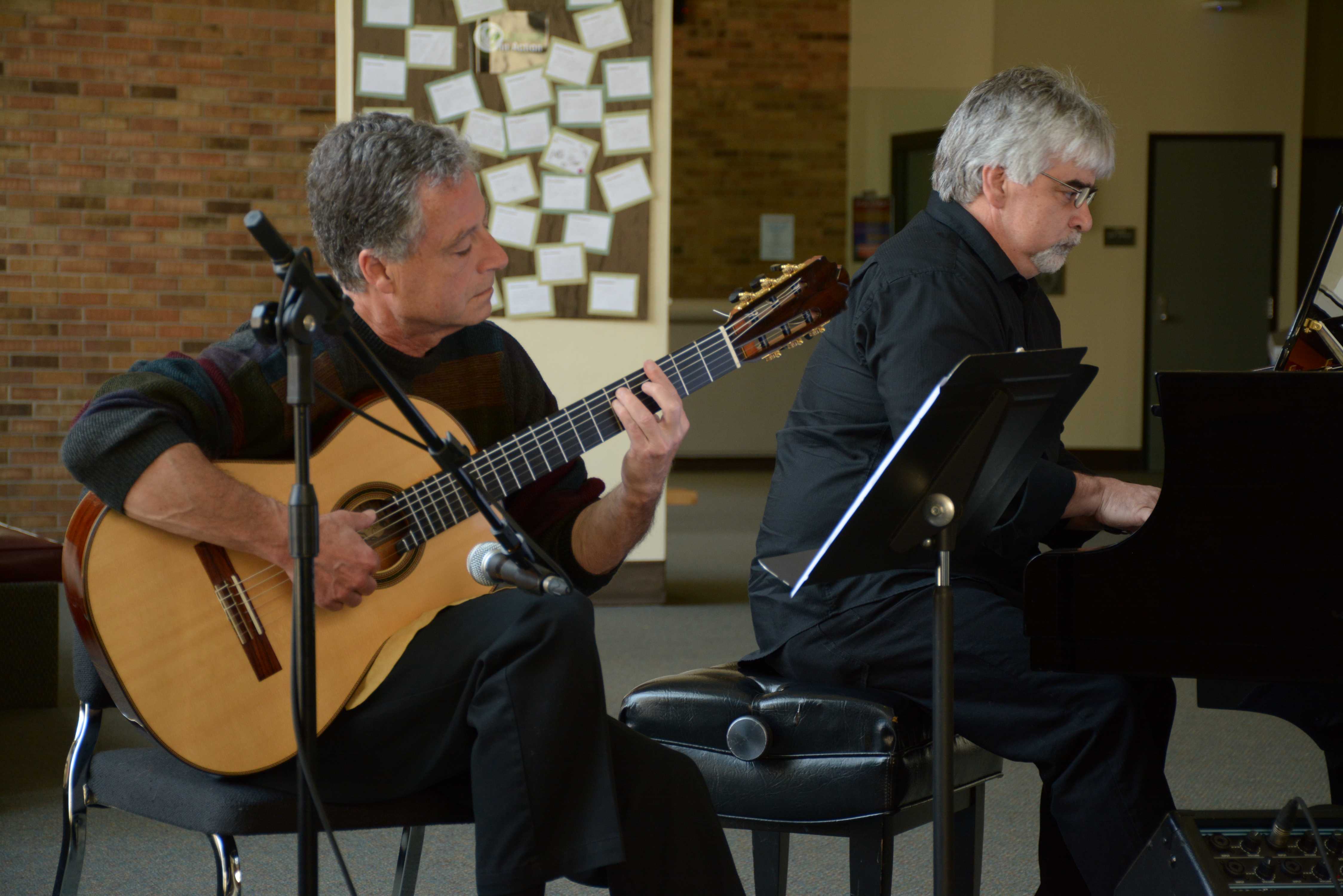 Photo by Jubenal Aguilar |Rodger Bennett and David Perez-Guerra play a song by Beethoven during the first coffee concert of the semester in the Performance Hall lobby March 23.