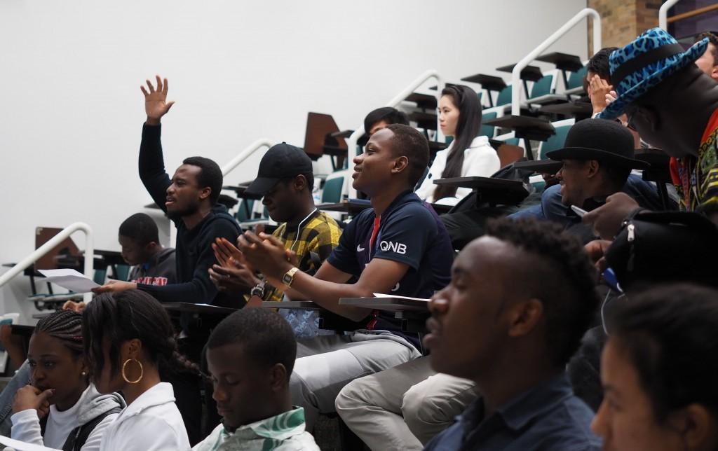 Photo by Jubenal Aguilar | International student Kassy Legrand, from Ivory Coast, raises his hand to the beat of "We Are One (Ole Ola)," the official song of the 2014 FIFA World Cup by Pitbull featuring Jennifer Lopez and Claudia Leitte as everyone else sings along.