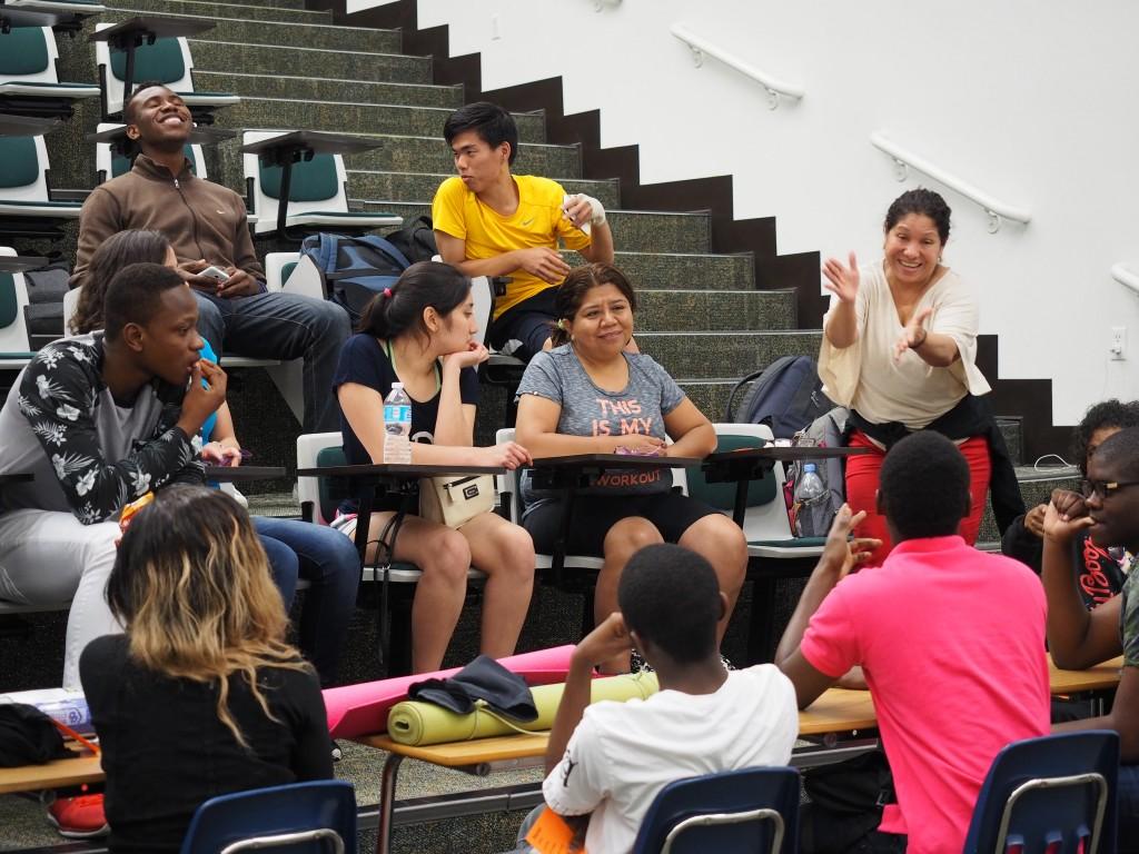 ESOL student Beneriana Malone, from Mexico, gives clues to a sports-related term as her classmates attempt guess it. Vocabulary and conversational activities in the pilot program are designed to engage students and help them learn English.