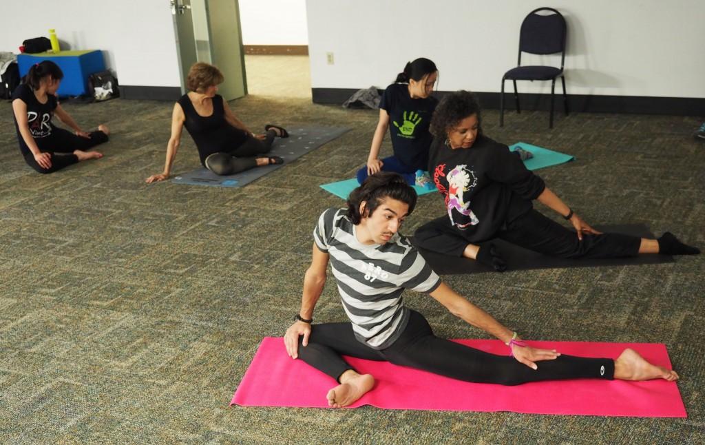  Photo by Jubenal Aguilar | ESOL students and faculty practice yoga as one of the sports activities in the ESOL Sports program. The class is led by Mohemed Almohaid (bottom), a student from Kuwait.