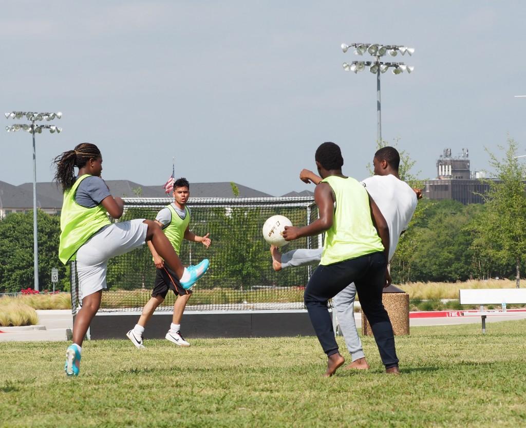 Photo by Jubenal Aguilar | International students Naima Abdoulaye, from Chad; Alberto Solorio, from Mexico; Roger Dasset, from Ivory Coast; and Kppnorh Modest, from Benin, go after the soccer ball.