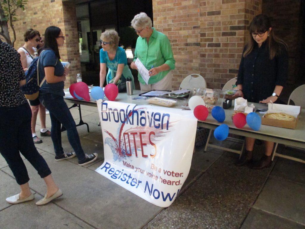 Photo by Stephon Smith Jane Hoffman, a volunteer for Dallas County Young Democrats, and Nelda Reid, a volunteer with Univision, helps students, staff and faculty register to vote Sept. 7 in the Commons Courtyard.