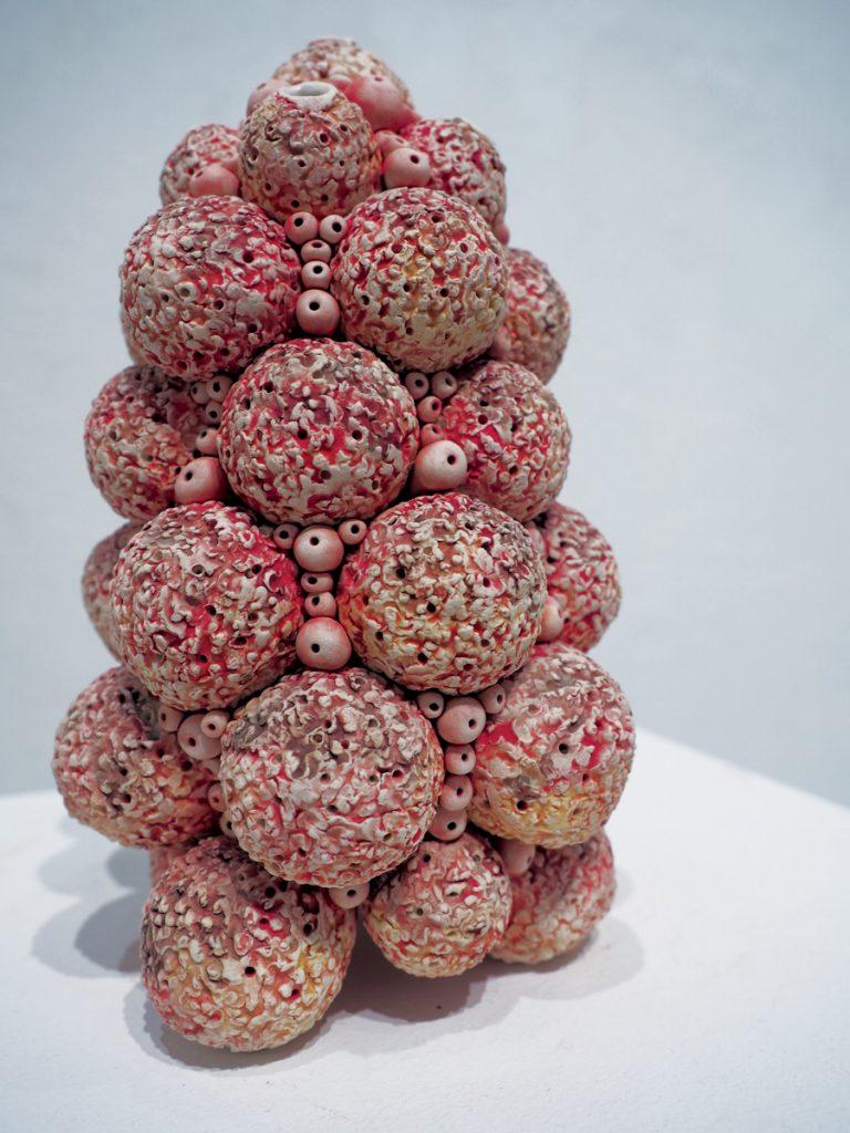 An orb vessel is reminiscent of coral reefs; Hill explains how she makes the orb vessel art pieces.