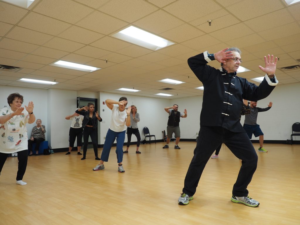 Photo by Jubenal Aguilar Glenn Kasparian, biology professor, teaches students the “fair lady throws shuttle” move from the 24 form of tai chi as part of his class, Sept. 29.