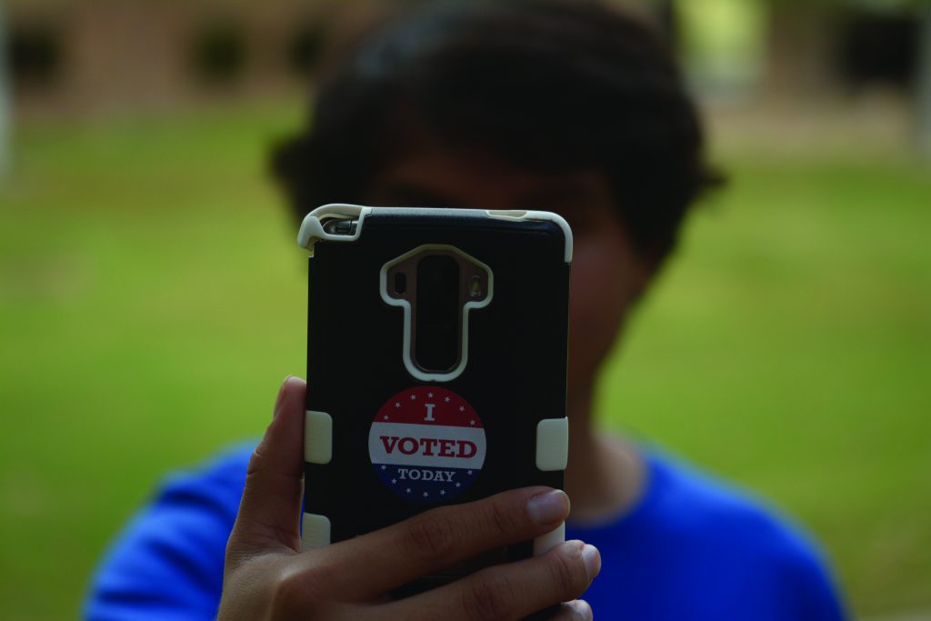 Photo illustration by Jubenal Aguilar Some states have outlawed voters taking selfies or other photos in and around polling places. 